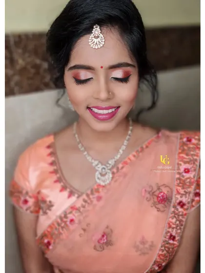 A happy client with her soft glam makeover for a family function. This is a great example of the kind of versatile, pretty look we practice in my classes.