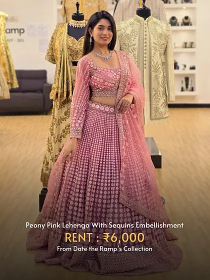 A peony pink lehenga with all-over sequin embellishment, offering a glamorous and feminine look.