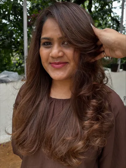 A beautiful color refresh for this client, getting her vacay-ready. I added soft, natural-looking highlights to her long hair and finished with a layered cut and bouncy curls for a glamorous feel.