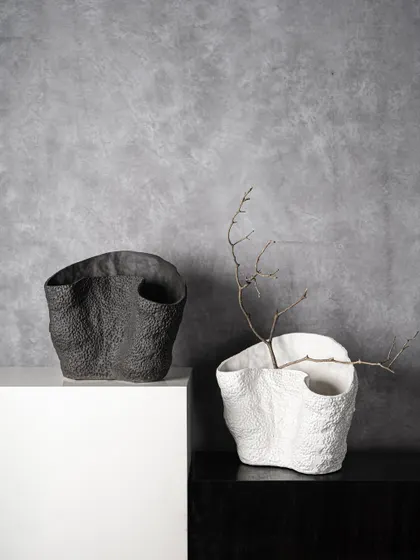 The raw, volcanic texture of these black and white ceramic bowls makes them feel elemental and timeless. They are perfect for adding a touch of organic modernism to your decor, with or without botanicals.