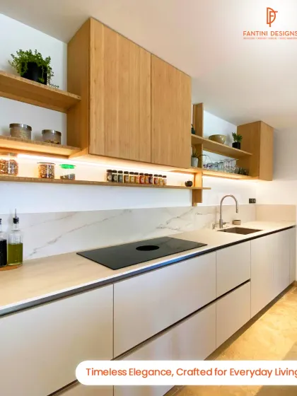 A minimalist kitchen design featuring light wood upper cabinets and open shelving, paired with sleek white base units and a marble-patterned backsplash.