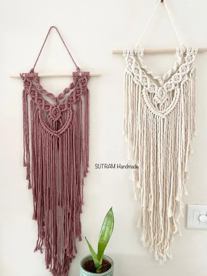 A closer look at two of the color options for this V-shaped macrame wall hanging. The dusty rose and the natural off-white are both so soft and beautiful.