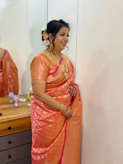 The client looking happy and confident with her final look.