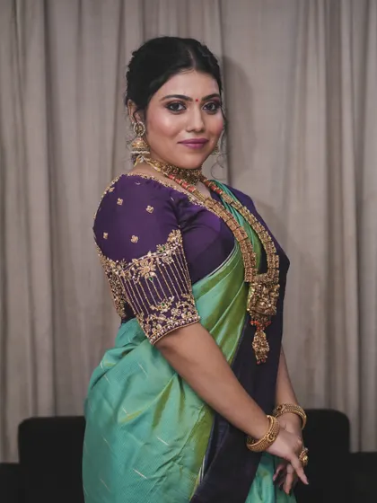 This portrait captures the soft and stunning impact of the makeup. It's a classic look that is perfect for a bride-to-be or a wedding guest who loves traditional style.