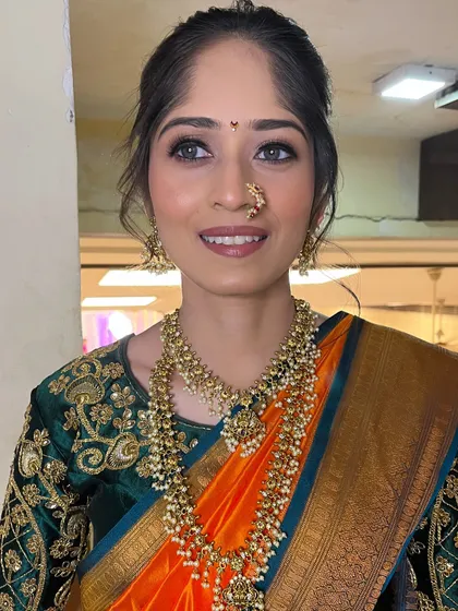 A bright, happy shot of Priyanka. The makeup is kept fresh and glowing to let her natural features shine.