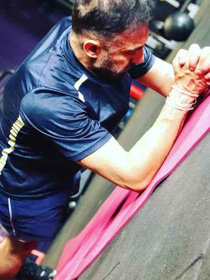 As a coach, I practice what I preach. Holding a strong plank is all about core stability and mental focus, two things I emphasize in my training programs.