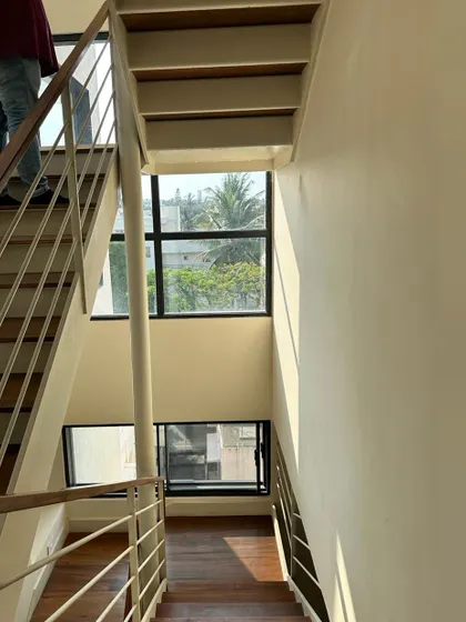 The design allows light to pass through the staircase, preventing it from feeling like a heavy, solid mass.