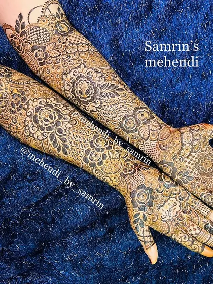 A luxury bridal design with a beautiful mix of floral and traditional patterns. The use of negative space and shading creates a stunning effect.