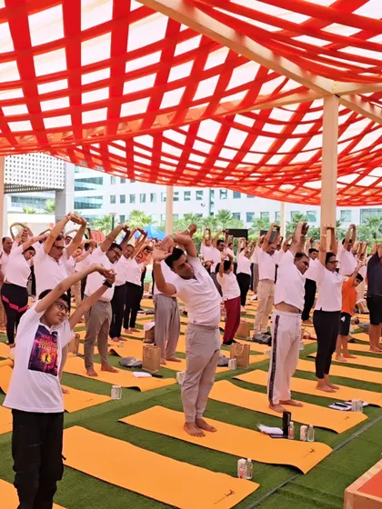Participants enjoying a side stretch during a large outdoor corporate event. These simple movements help release tension in the sides of the body and improve flexibility.