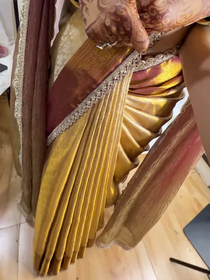 A detailed shot of the fluffy pleats. I specialize in creating these voluminous yet lightweight pleats that add a royal touch to any silk saree.