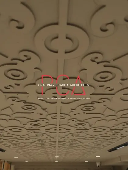 A detailed shot of the intricately carved ceiling at the Jubinav Chadha Fashion Studio. Inspired by traditional Indian temple architecture, this bespoke feature adds a layer of cultural richness and artistry to the modern retail space.