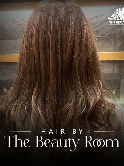 Our logo over the final result of this beautiful, multi-tonal hair color.