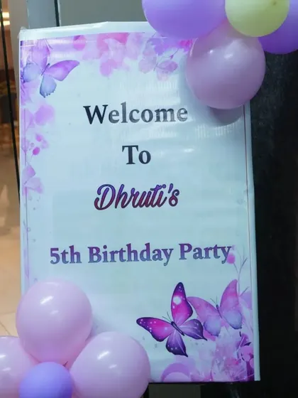 A personalized welcome sign for a butterfly-themed 5th birthday party.