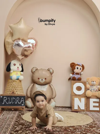 On the move! Capturing a baby crawling is a perfect way to remember this fleeting stage during their first birthday photoshoot.