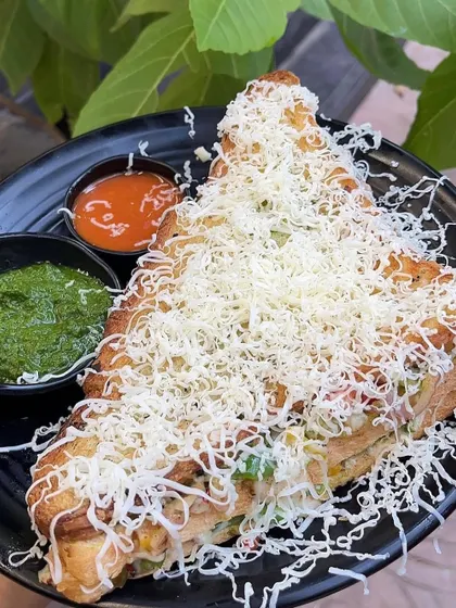 My classic veg cheese grill sandwich, loaded with cheese and served with our signature chutneys.