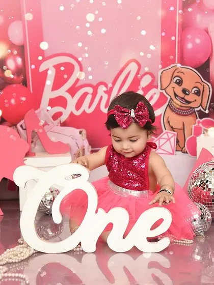 A Barbie girl in a Barbie world for her first birthday. This all-pink, super fun theme is perfect for celebrating the big "One" in style.