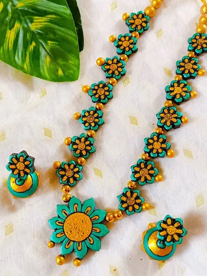 These are additional images of the floral necklace sets in various colors, showcasing the wide range of options available for bulk purchase.