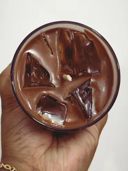 An overhead view of the iced coffee candle. The wax "ice cubes" look so realistic, and the coffee fragrance is irresistible.