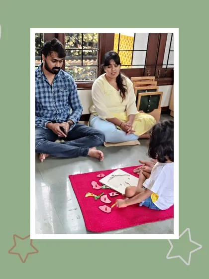Jasvi showcases her understanding of biology with a puzzle of a flower. Her parents watch with amazement and pride, seeing firsthand how she absorbs and articulates complex ideas.