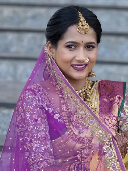 Jagruthi's wedding look, complete with a sheer purple veil that adds a touch of modern elegance to her traditional attire.