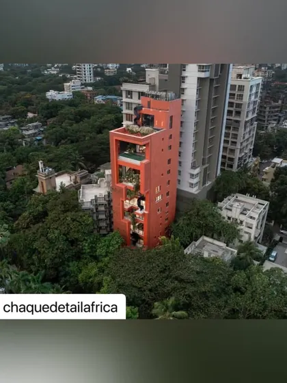 An aerial view looking down on the Sarvasva tower, showing how it stands out as a unique piece of architecture within its urban context.