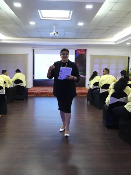 Another action shot from a corporate training day. I use a mix of presentation, activities, and Q&A to cover all aspects of professional development, from body language to communication skills.
