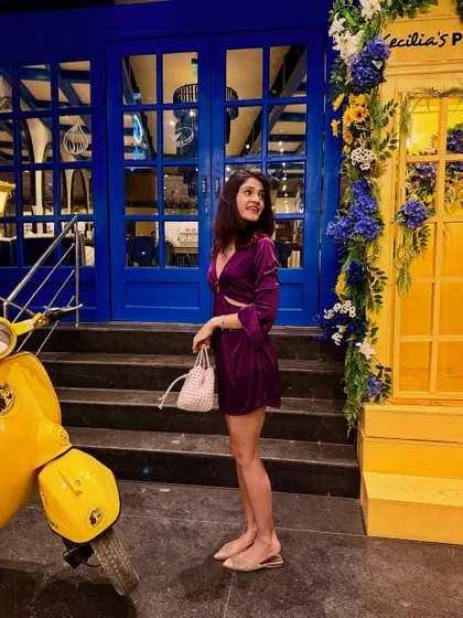 Another angle of my purple mini dress, this time with a cute yellow scooter. The bright colors of the background make the jewel tone of the dress pop even more.