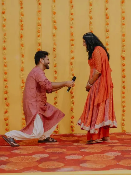 The groom's heartfelt proposal on stage. We create opportunities for couples to express their love in front of their friends and family, creating powerful, emotional memories.