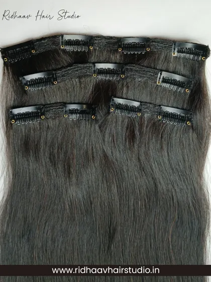 Our 4-piece premium straight clip-in extension set. This image shows the different weft sizes included in the set, allowing for customized placement and a full, natural look.