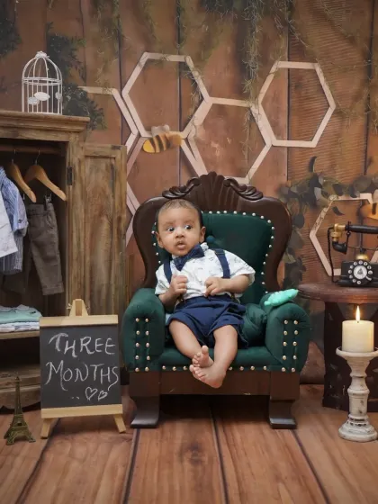 This shot from the three-month session includes a miniature wardrobe, adding a charming detail to the setup.