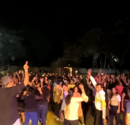 A moment of high energy with hands in the air.