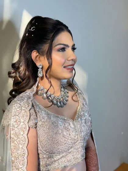 A close-up of the bride's sangeet makeup. We went for a flawless, matte base with defined brows and a neutral lip to balance the shimmery outfit.