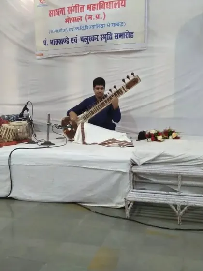 Another angle from the Ganesh Chaturthi concert, showing the traditional stage setup for a small gathering.