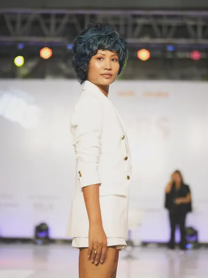 On the runway for the Wella Professionals showcase, I created this edgy and modern makeup look. The clean skin and defined eyes were designed to complement the bold, blue-toned creative hairstyle, making a strong statement on stage.