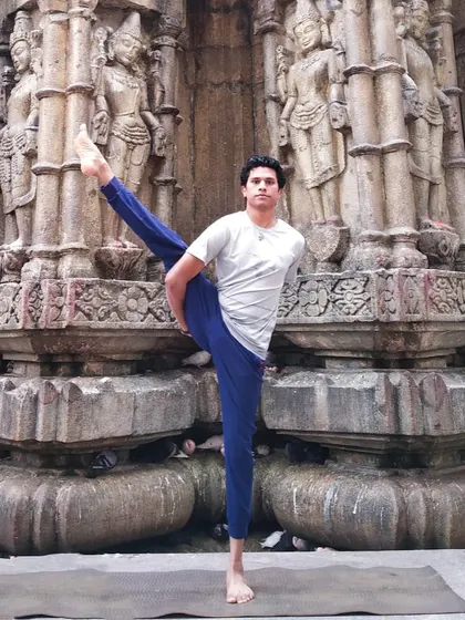 Practicing a standing balancing pose at a temple site connects the physical effort with a higher spiritual purpose. A healthy outside truly begins from the inside, with a focused mind and a dedicated spirit.