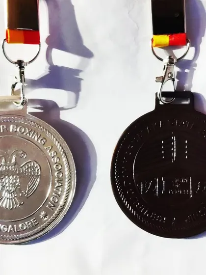 A close up of the silver and bronze medals won by my students at the Karnataka State Boxing Championship. These represent the hard work and dedication required to succeed in amateur boxing.