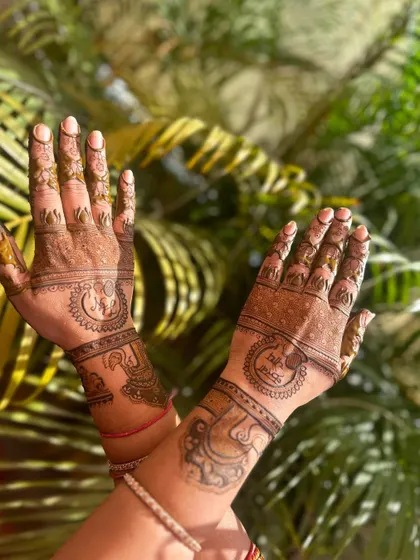 A simple back-hand design for Karwa Chauth.