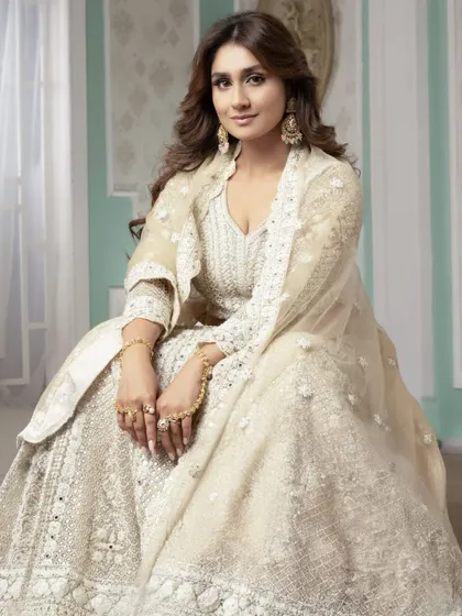 A full-length view of this elegant look, showing how the makeup and hair work in harmony with the outfit. Our students are trained to create cohesive and polished final looks.