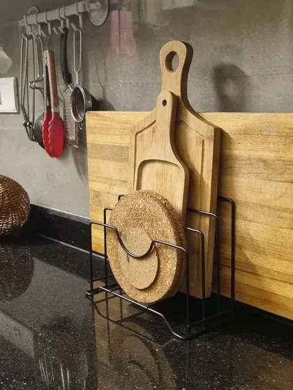 This vertical slotted organizer is one of my favorite practical products. It's perfect for keeping chopping boards and even a chakla belan (rolling pin and board) upright and off the counter.