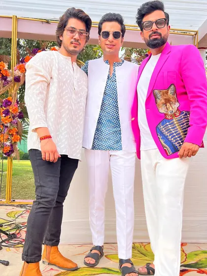 Posing with friends at a spectacular wedding function. It's the people and the energy that make these events so memorable.