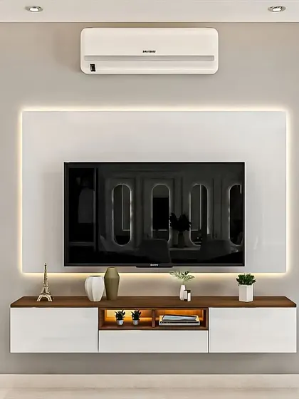 This sleek, minimalist TV unit is perfect for a modern apartment. The glossy white console floats off the ground, and the entire setup is framed with a soft LED glow, creating a clean and futuristic look.