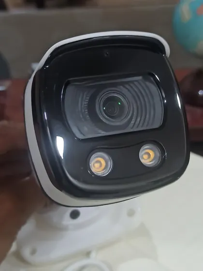 A close-up of the lens and dual spotlights on a color night vision camera. This technology is a game-changer for identifying details like clothing or car color at night.
