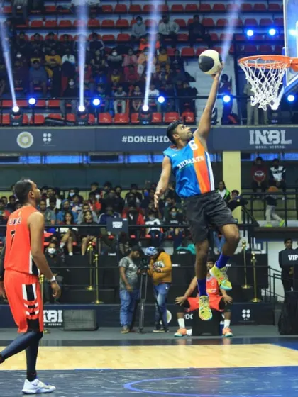 Taking it to the hoop during the INBL 3x3 national tournament. This high-level competition is where skills are truly tested.