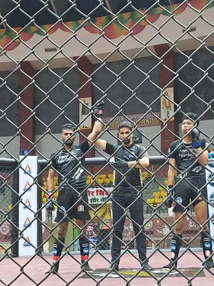 The moment of victory. Our fighters getting their hands raised in the cage after a hard-fought battle on Day 1 of the nationals.