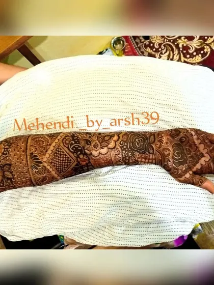 A single-arm view of a heavy bridal design, showing the flow of the pattern from the hand all the way up the forearm. This style is perfect for sleeveless bridal outfits.