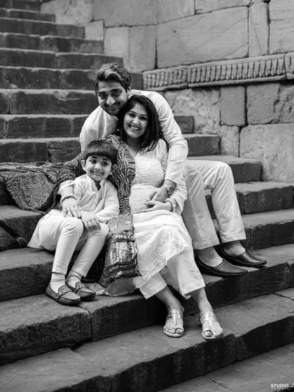 A family portrait on the steps of history, waiting for a new chapter to begin. This black and white shot feels absolutely timeless.