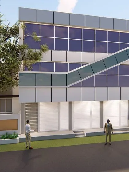 A 3D concept for a modern commercial building, featuring a glass curtain wall and an external staircase. This design is suitable for retail showrooms on the ground floor and offices on the upper levels.