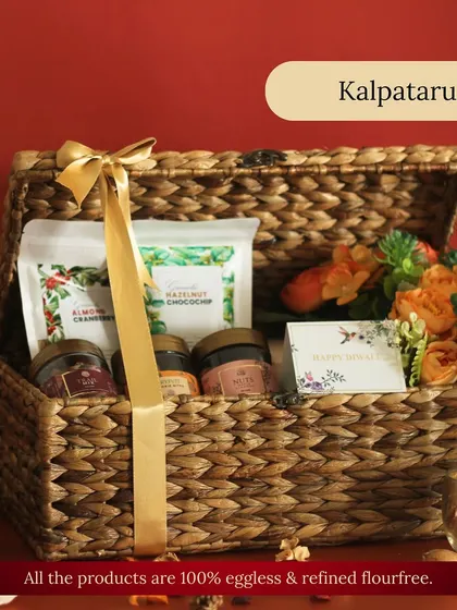 The Kalpataru 1.0 hamper is pure indulgence in a reusable trunk. It’s packed with our almond cranberry and hazelnut chocochip granola, assorted nuts, mukhwas, and a "Happy Diwali" card.
