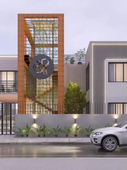 A view of the upcoming residence from a different angle, showing the balance between the solid grey volumes and the warm, textured brick tower. The design plays with contrast in both material and form.