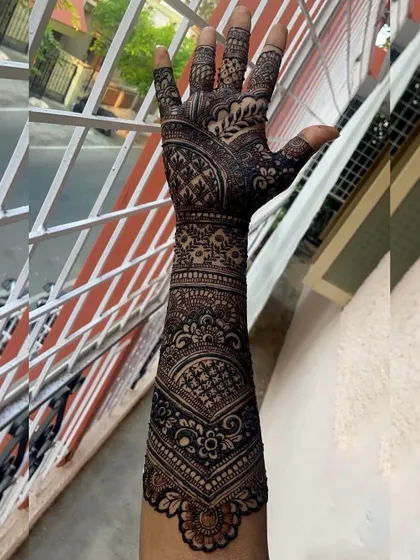 Another view of the full-arm bridal design from ID 42, showing the consistency and detail of the pattern as it wraps around the arm.